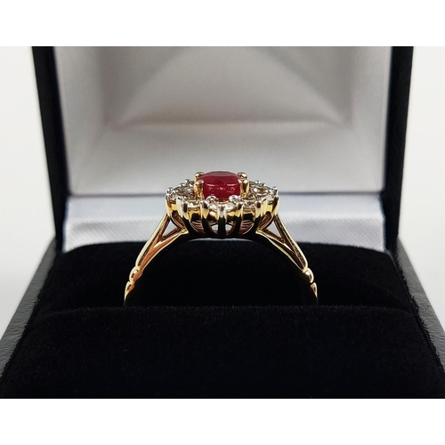 31 - A 9CT YELLOW GOLD RUBY AND DIAMOND RING, the mixed cut ruby of approximately 1 carat, surrounded by ... 