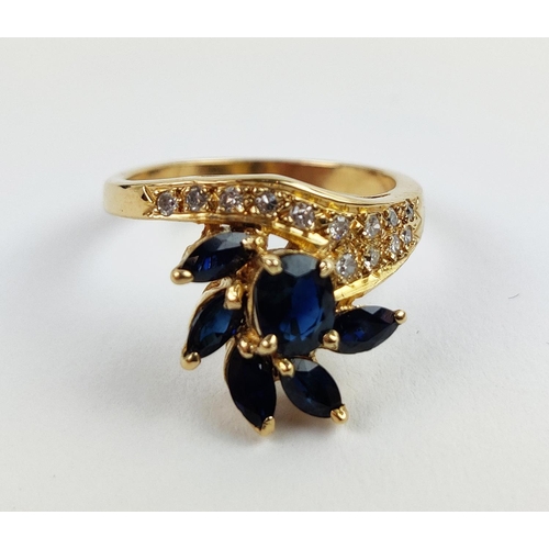 38 - A YELLOW METAL SAPPHIRE AND DIAMOND SET DRESS RING, probably 18ct gold, asymmetrical floral spray wi... 