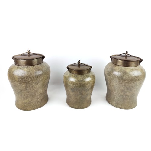 4 - THREE JARS AND COVERS, shagreen finish, to ceramic bodies, brass covers, inverted baluster form, 37c... 