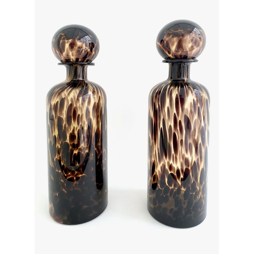 310 - DECANTERS, a pair, Murano style tortoiseshell  glass, 40cm H x 10cm W x 10cm D. (2)