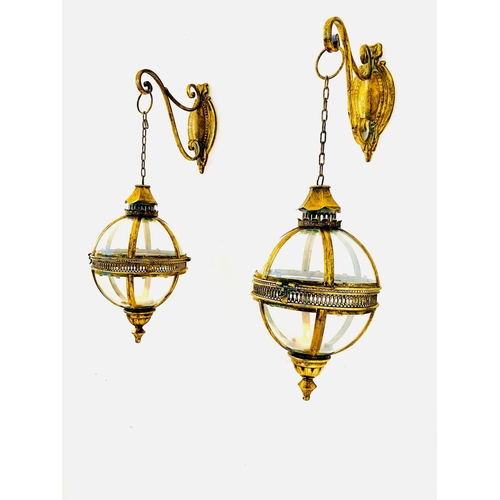 322 - WALL HANGING GLOBE LANTERNS, a pair, Regency style gilt metal and glass, 80cm H x 25cm W x 25cm D. (... 