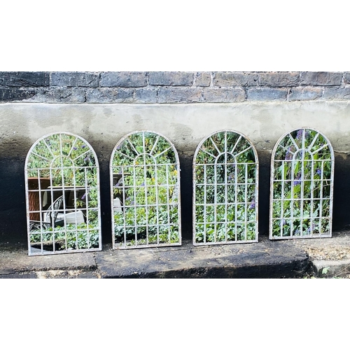 324 - ARCHITECTURAL GARDEN MIRRORS, a set of four, arched metal frames, 60cm H x 36cm W. (4)