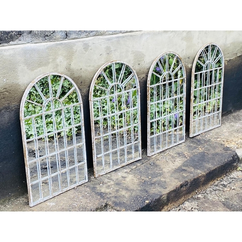 324 - ARCHITECTURAL GARDEN MIRRORS, a set of four, arched metal frames, 60cm H x 36cm W. (4)