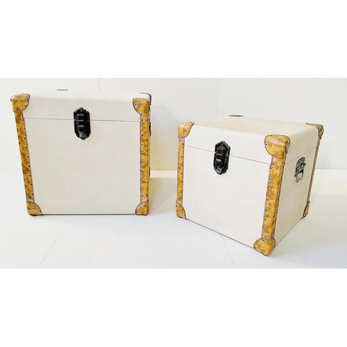 332 - TRUNKS, graduated set of two, canvas and leather, largest 50cm H x 50cm W x 50cm D. (2)