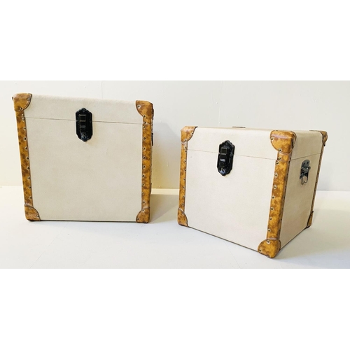 332 - TRUNKS, graduated set of two, canvas and leather, largest 50cm H x 50cm W x 50cm D. (2)