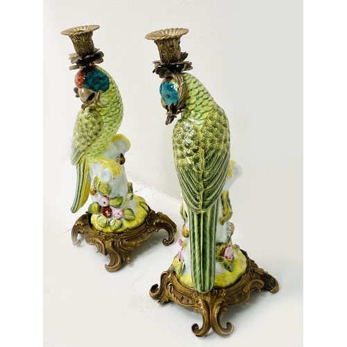 335 - PARROT CANDLESTICKS, a pair, painted ceramic and gilt metal. (2)