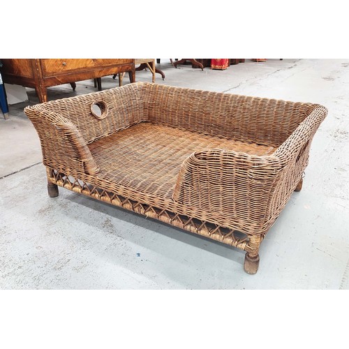 353 - DOG BED, in wicker, 42cm H x 105cm W x 75cm D.