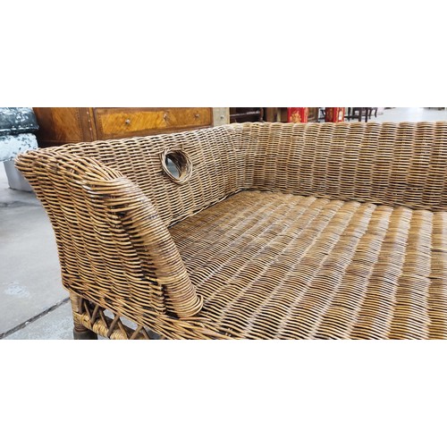 353 - DOG BED, in wicker, 42cm H x 105cm W x 75cm D.