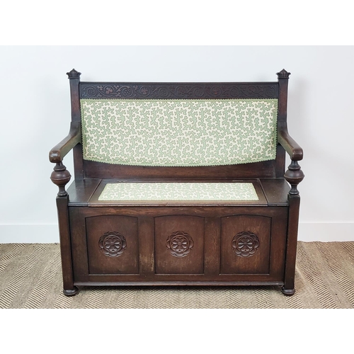 358 - SETTLE, early 20th century oak, with hinged padded seat in green Colefax and Fowler fabric, 100cm H ... 