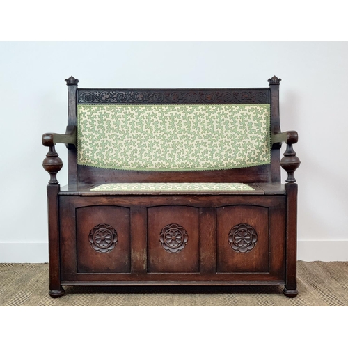 358 - SETTLE, early 20th century oak, with hinged padded seat in green Colefax and Fowler fabric, 100cm H ... 