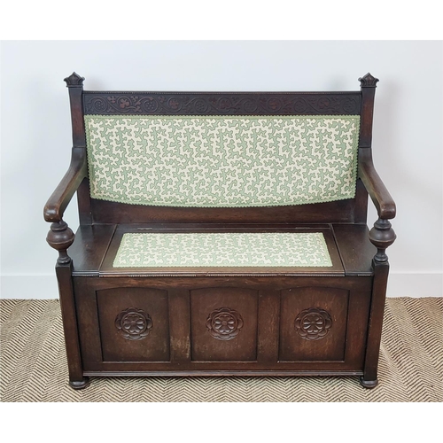 358 - SETTLE, early 20th century oak, with hinged padded seat in green Colefax and Fowler fabric, 100cm H ... 