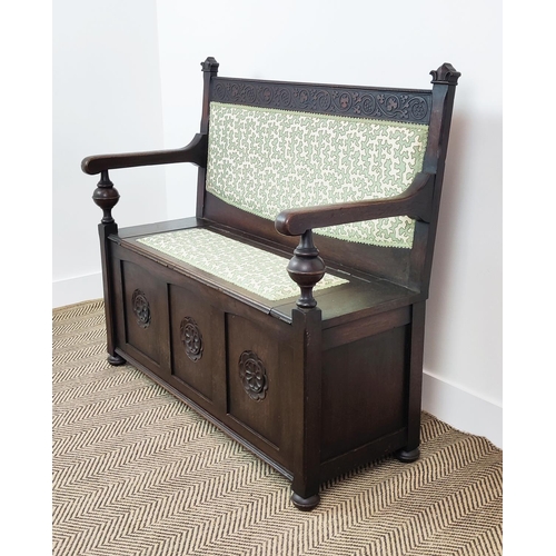 358 - SETTLE, early 20th century oak, with hinged padded seat in green Colefax and Fowler fabric, 100cm H ... 