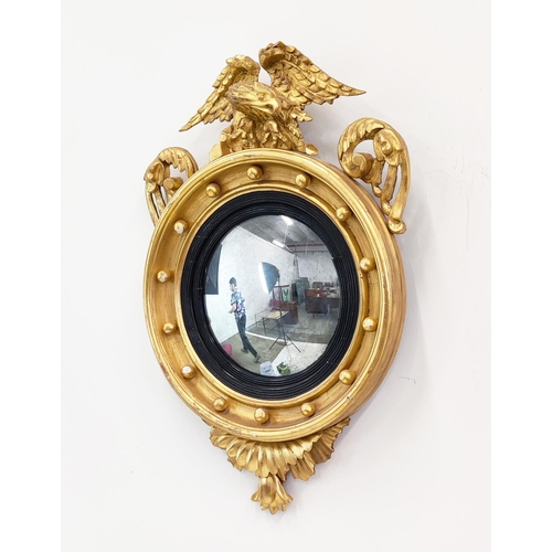 369 - CONVEX MIRROR, Regency, with eagle surmount, 82cm H x 56cm W.