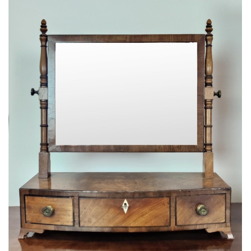 373 - TOILET MIRROR, with a tilting glass plate and serpentine base with three drawers, 65cm H x 46cm W an... 