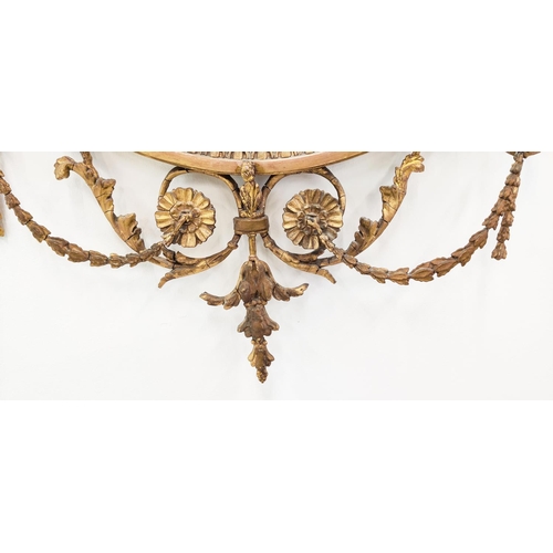 379 - WALL MIRROR, circular gilt wood with Adam style urn detail, with a bevelled plate, 93cm H x 60cm W.