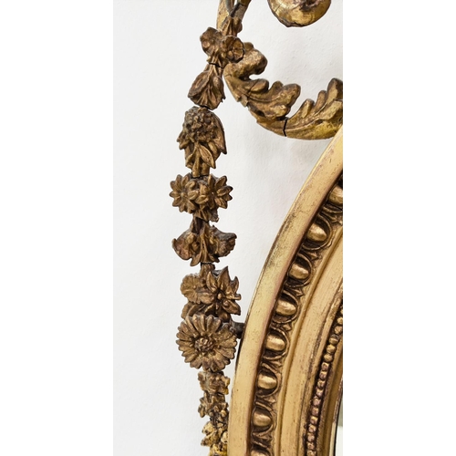 379 - WALL MIRROR, circular gilt wood with Adam style urn detail, with a bevelled plate, 93cm H x 60cm W.