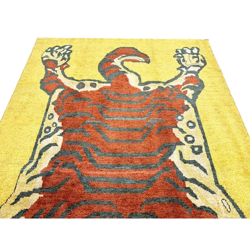 132 - FINE TIBETAN TIGER CARPET, 254cm x 180cm.