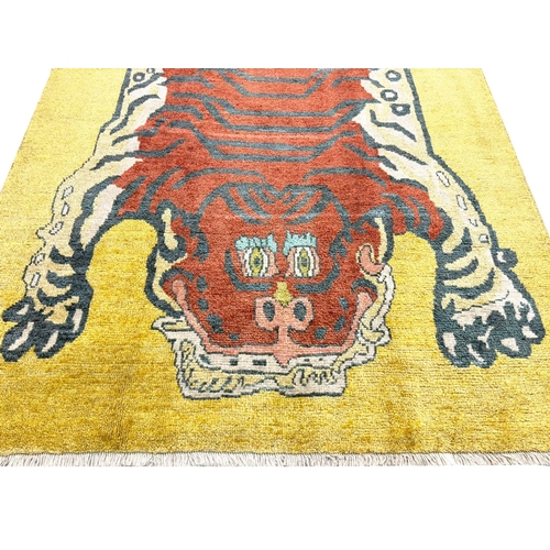 132 - FINE TIBETAN TIGER CARPET, 254cm x 180cm.