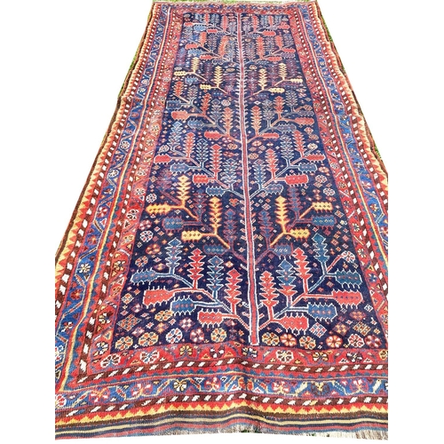 142 - ANTIQUE NORTH WEST PERSIAN BAKTIARI CORRIDOR CARPET, 365cm x 150cm.