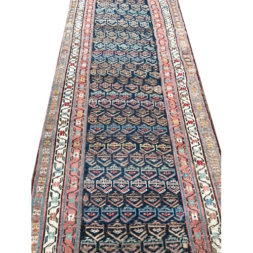 147 - ANTIQUE BOTCH DESIGN PERSIAN RUNNER, 420cm x 100cm.