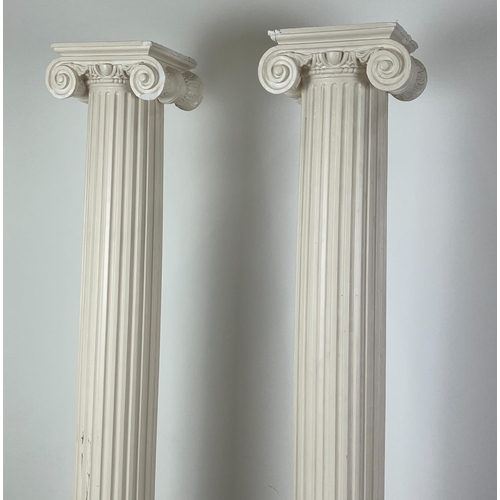 159 - ARCHITECTURAL COLUMNS, a pair, painted plaster with ionic capitals, 207cm H. (2)