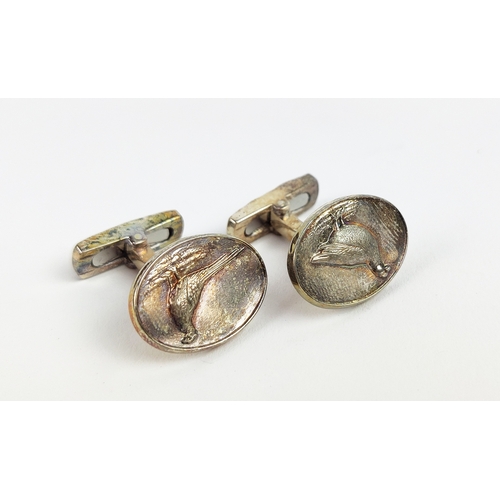 19 - CUFFLINKS, three pairs, including Gucci and Tiffany and a Christofle champagne stopper.