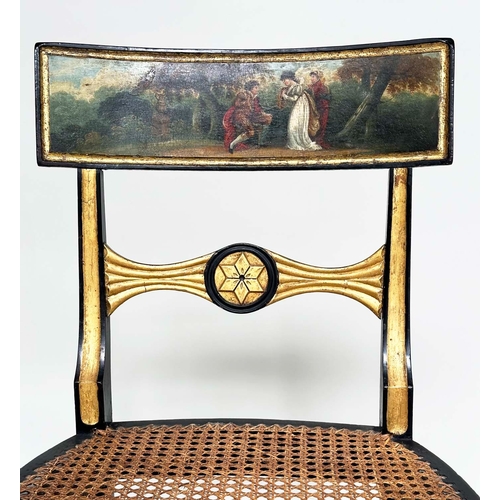 194 - REGENCY SIDE CHAIRS, a pair, ebonised and parcel gilt each with hand painted bow back rail and cane ... 