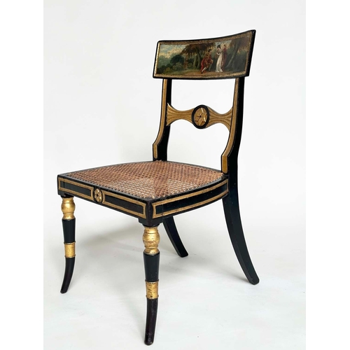 194 - REGENCY SIDE CHAIRS, a pair, ebonised and parcel gilt each with hand painted bow back rail and cane ... 