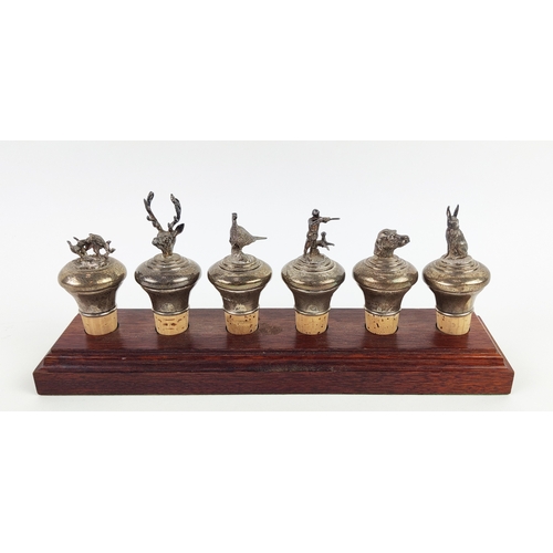 2 - SILVER STOPPERS, a collection of six, hunting themed marked B and Co, 925, Sheffield on wooden stand... 