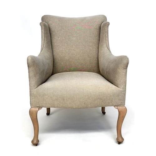 214 - WINGBACK ARMCHAIR, English early 20th century with natural linen upholstery and cabriole front suppo... 