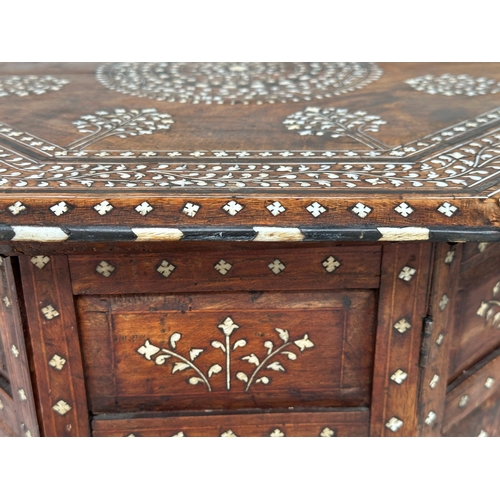 215 - HOSHIARPUR TABLE, late 19th/early 20th century North Indian octagonal bone and ebony inlaid, retaini... 