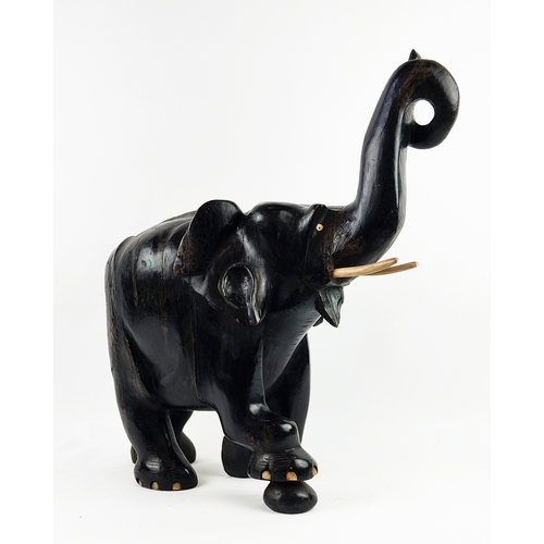 22 - ELEPHANT, carved hardwood in ebony finish, 70cm L x 70cm H.