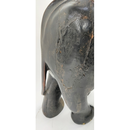 22 - ELEPHANT, carved hardwood in ebony finish, 70cm L x 70cm H.