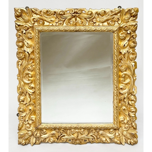 221 - FLORENTINE WALL MIRROR, Italian 19th century Florentine carved giltwood with foliate and C scroll fr... 