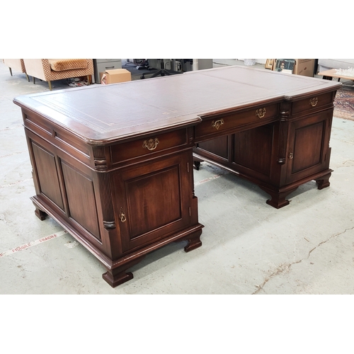 235 - PARTNER'S DESK, Georgian style mahogany with burgundy leather top above nine drawers, opposed by thr... 