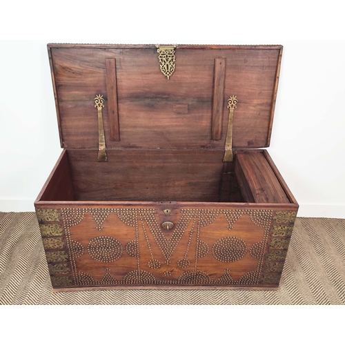 238 - ZANZIBAR TRUNK, teak with brass studded decoration, 63cm H x 130cm W x 63cm D.