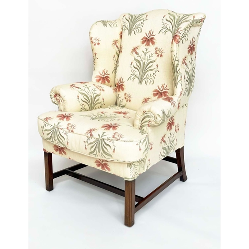 271 - WINGBACK ARMCHAIR, George III period mahogany with early English style printed linen upholstery, fea... 