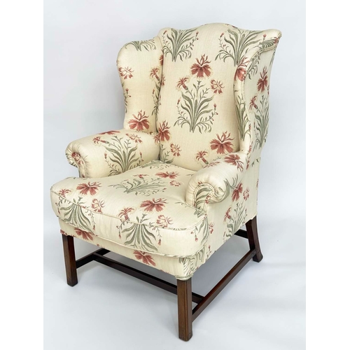 271 - WINGBACK ARMCHAIR, George III period mahogany with early English style printed linen upholstery, fea... 