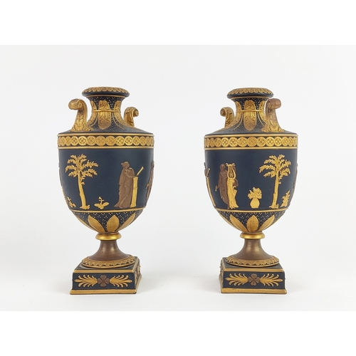 3 - WEDGWOOD BLACK AND GILT BASALT VASES, a pair, 19th century classical Grecian urn form with figurativ... 