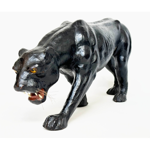 304 - LIBERTY STYLE PANTHER, in the manner of Liberty of London leather covered, 70cm W x 34cm H.