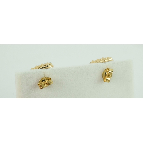 35 - A PAIR OF DIAMOND STUD EARRINGS, each set with nine princess-cut diamonds to centres with sixteen ro... 