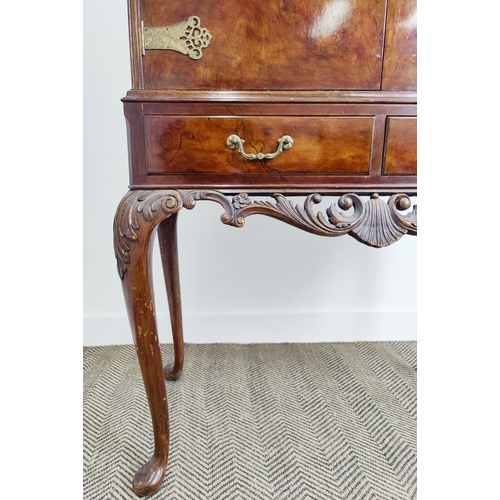 355 - COCKTAIL CABINET, Queen Anne style burr walnut, with cupboard door, over two drawers on a carved sta... 