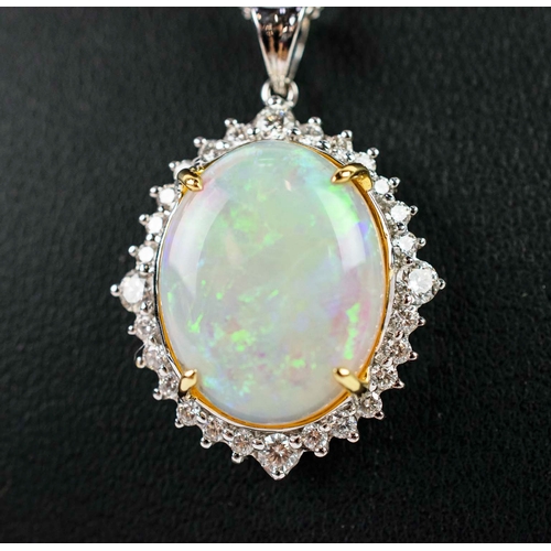 36 - AN 18CT WHITE GOLD OPAL AND DIAMOND PENDANT, the large opal cabouchon of approximately 7.45 carats, ... 