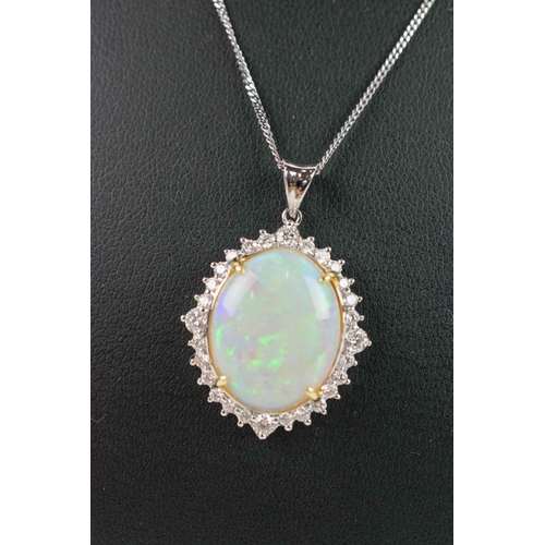 36 - AN 18CT WHITE GOLD OPAL AND DIAMOND PENDANT, the large opal cabouchon of approximately 7.45 carats, ... 