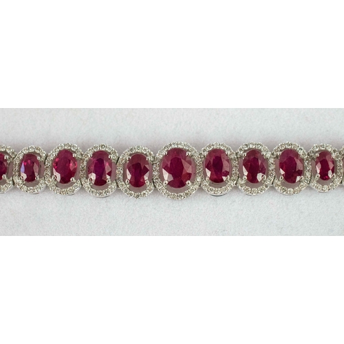 38 - AN 18CT WHITE GOLD RUBY AND DIAMOND BRACELET, the links of graduated size each set with a mixed cut ... 