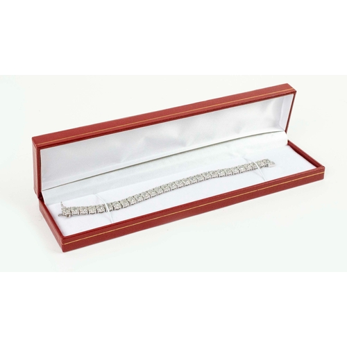 40 - A 14CT WHITE GOLD DIAMOND BRACELET, formed of 290 individually set diamonds on 29 links. each with a... 