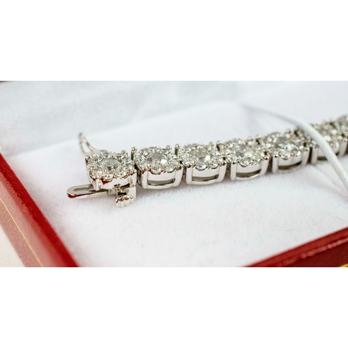 40 - A 14CT WHITE GOLD DIAMOND BRACELET, formed of 290 individually set diamonds on 29 links. each with a... 