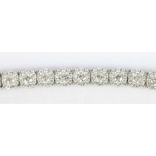 40 - A 14CT WHITE GOLD DIAMOND BRACELET, formed of 290 individually set diamonds on 29 links. each with a... 