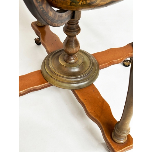 400 - GLOBE COCKTAIL CABINET, in the form of an antique terrestrial globe on stand with rising lid and fit... 