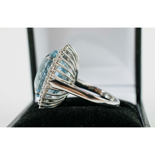 41 - AN 18CT WHITE GOLD AND PLATINUM AQUAMARINE AND DIAMOND DRESS RING, the large oval mixed cut aquamari... 